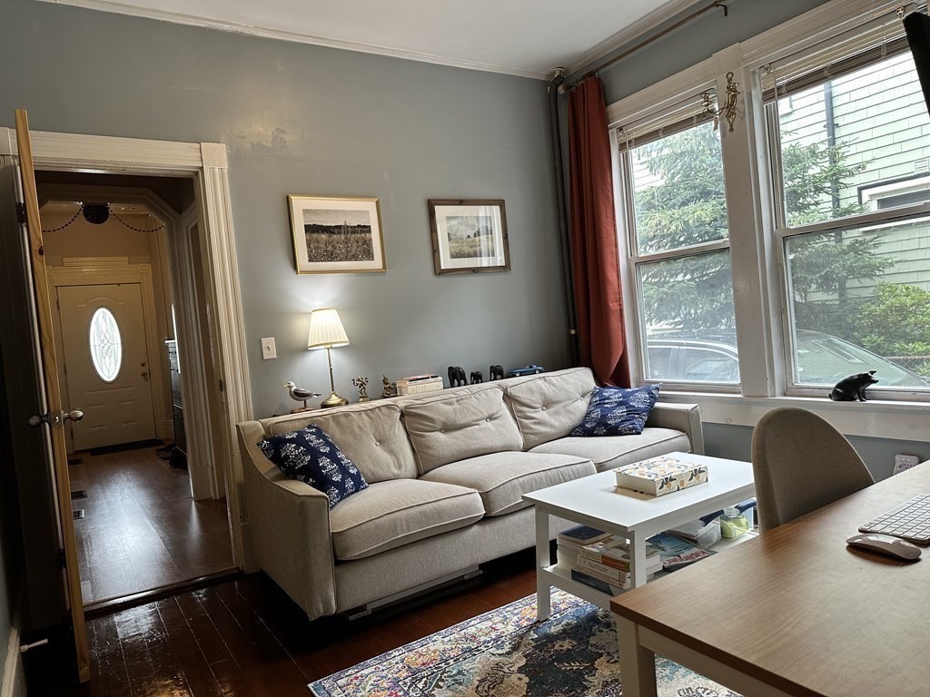 52 Harvest Street, Unit 1 Boston, MA 02125 - Photo 18 of 35 a living room with furniture and a lamp