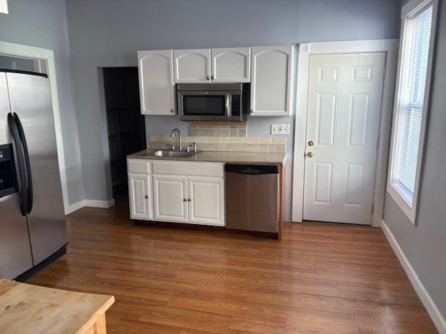 52 Harvest Street, Unit 1 Boston, MA 02125 - Photo 20 of 35 a kitchen with stainless steel appliances a refrigerator sink and microwave