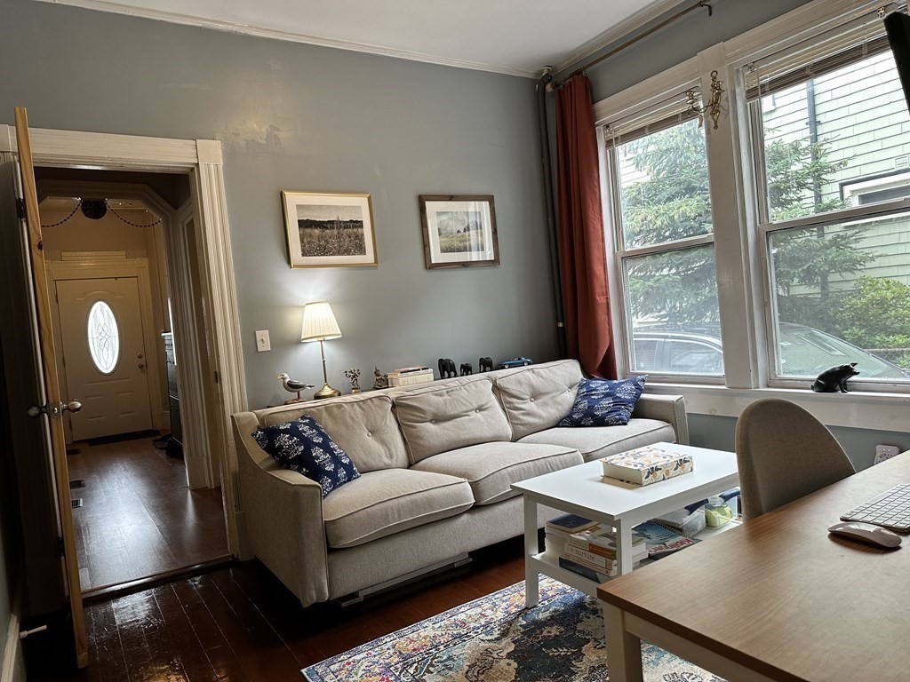 52 Harvest Street, Unit 1 Boston, MA 02125 - Photo 2 of 35 a living room with furniture and a lamp
