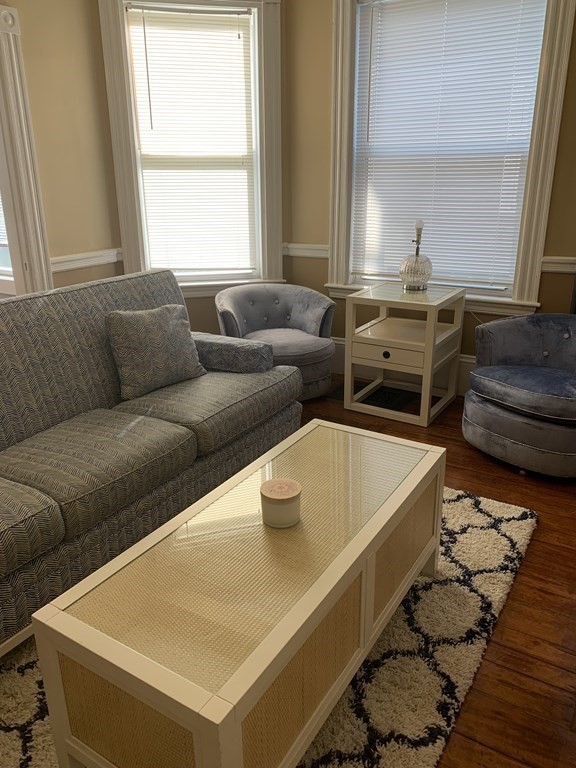 52 Harvest Street, Unit 1 Boston, MA 02125 - Photo 27 of 35 a living room with furniture and a window
