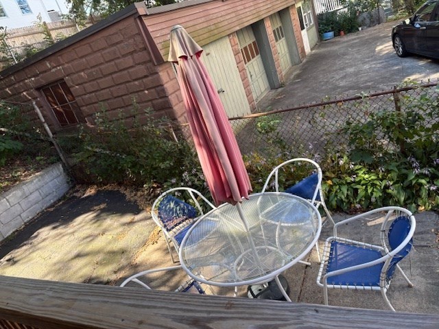 52 Harvest Street, Unit 1 Boston, MA 02125 - Photo 28 of 35 a backyard of a house with outdoor seating