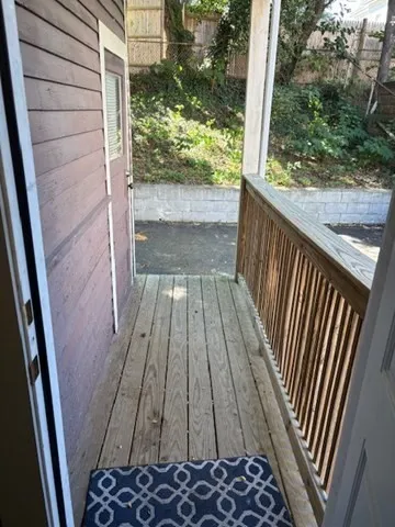 a bathroom with a window shower and a sink