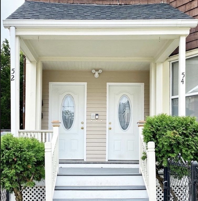 52 Harvest Street, Unit 1 Boston, MA 02125 - Photo 4 of 35 a front view of a house with entryway