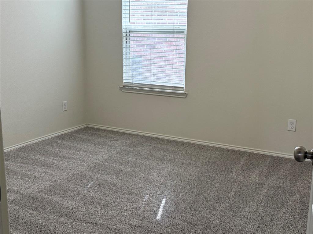 2225 Heaton Street Forney, TX 75126 - Photo 16 of 21 Secondary bedroom with closet and window.