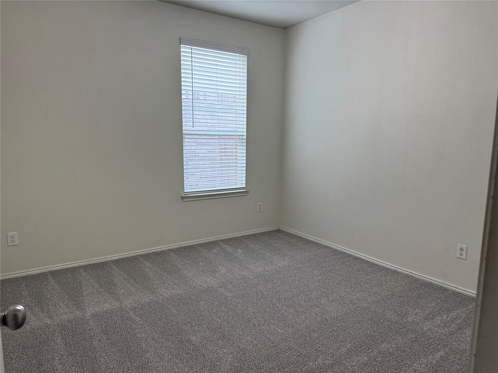 2225 Heaton Street Forney, TX 75126 - Photo 17 of 21 Secondary bedroom with closet and window.