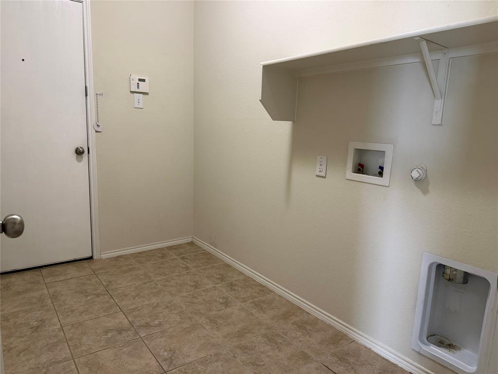 2225 Heaton Street Forney, TX 75126 - Photo 19 of 21 Laundry room with access to garage.