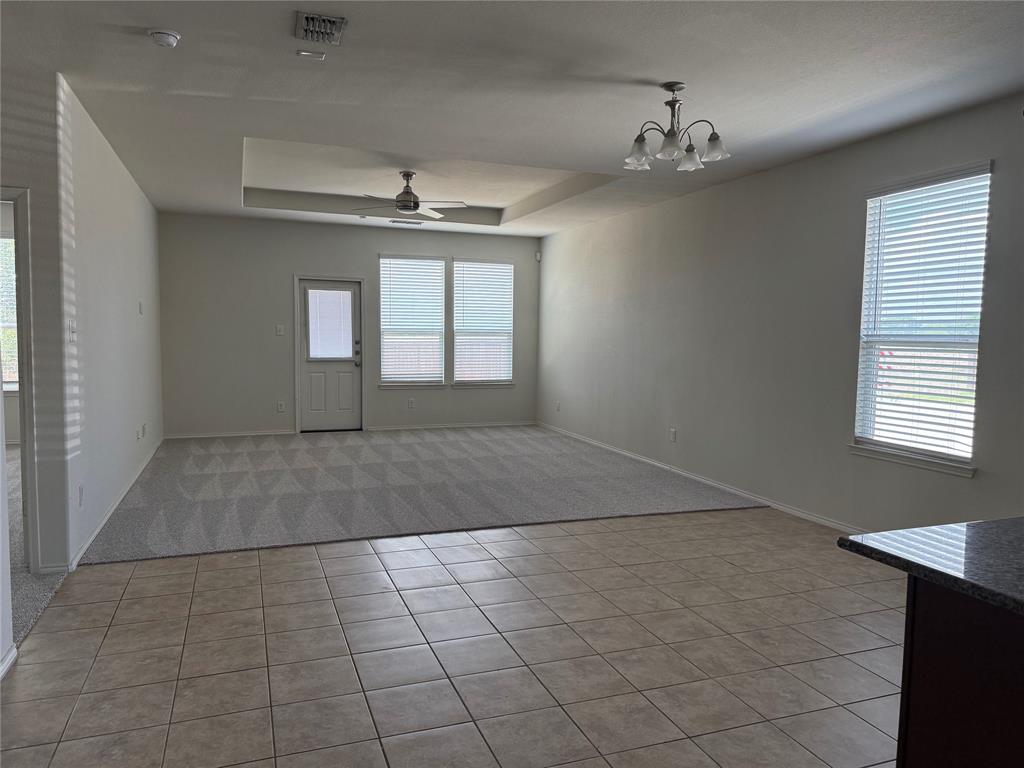 2225 Heaton Street Forney, TX 75126 - Photo 9 of 21 Open concept living room to kitchen and eat in dining.