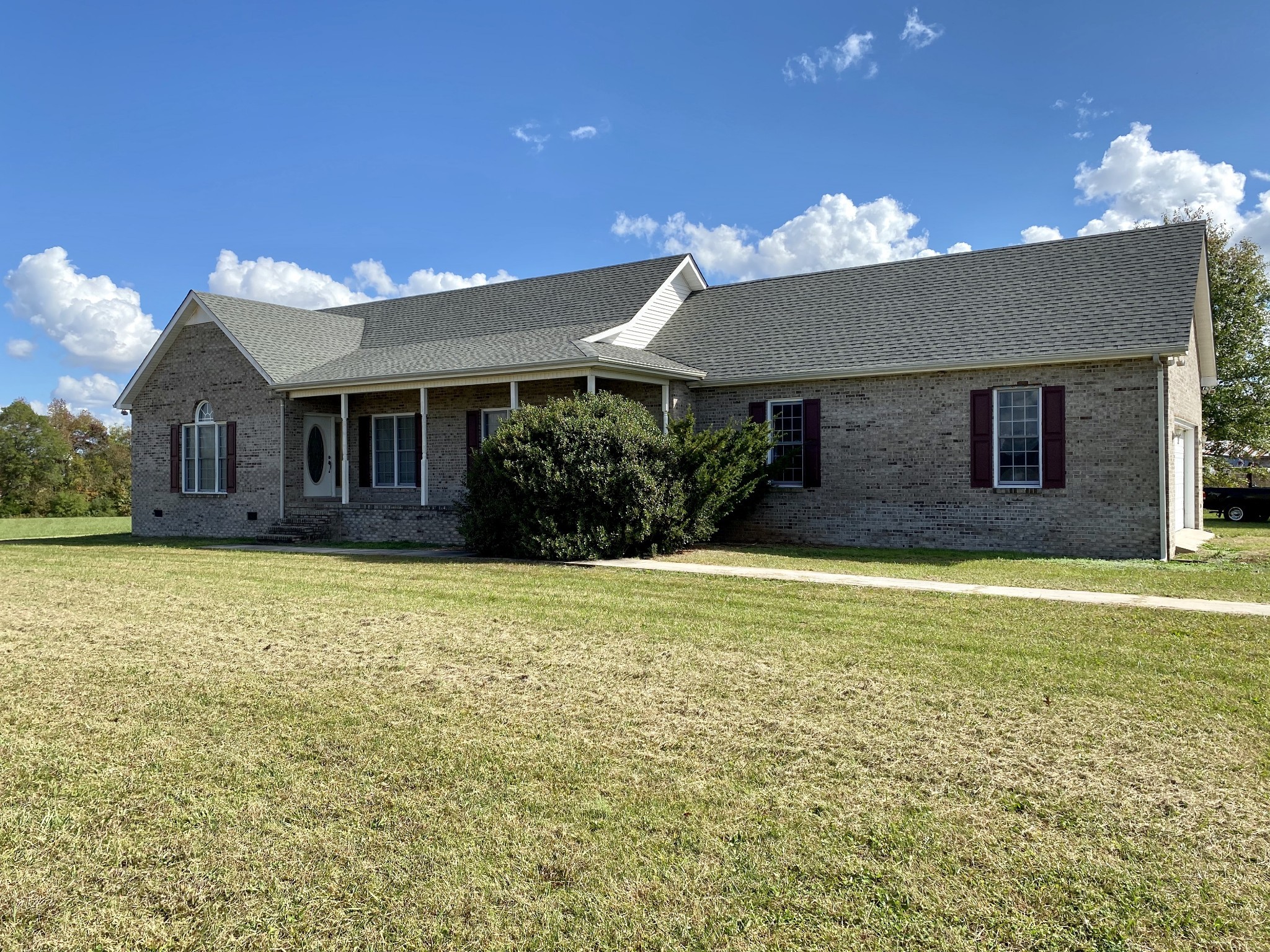 4074 Gum Creek Road Decherd, TN 37324 - Photo 2 of 17 a view of a house with a backyard and a garden