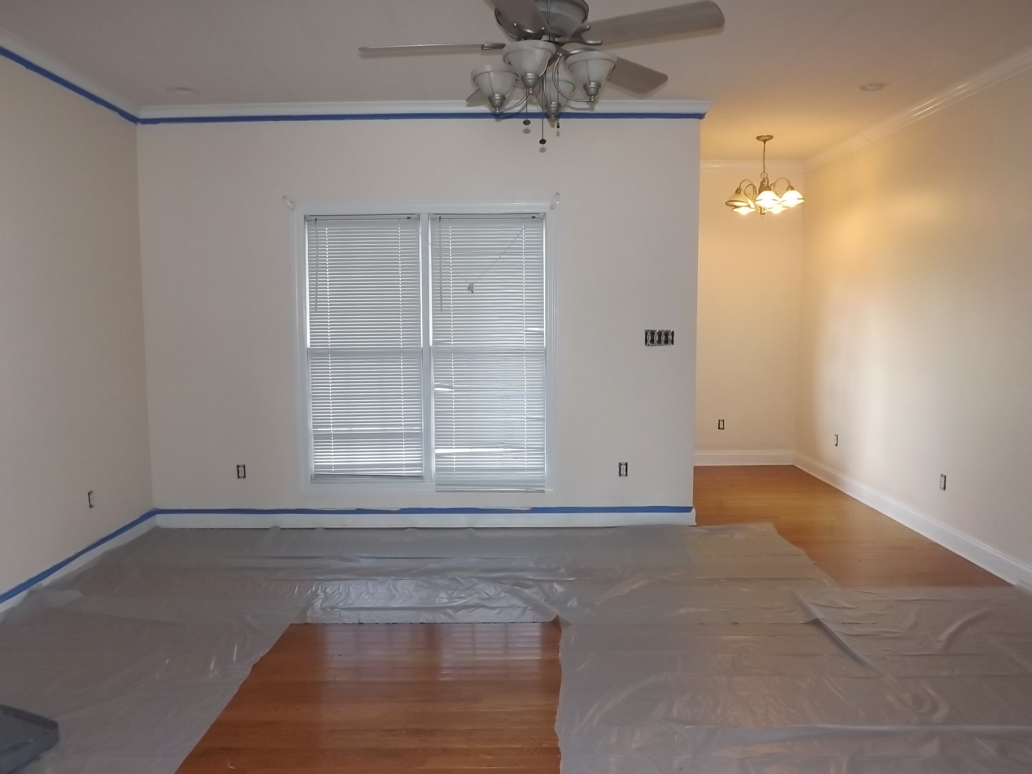 4074 Gum Creek Road Decherd, TN 37324 - Photo 6 of 17 an empty room with chandelier fan and windows