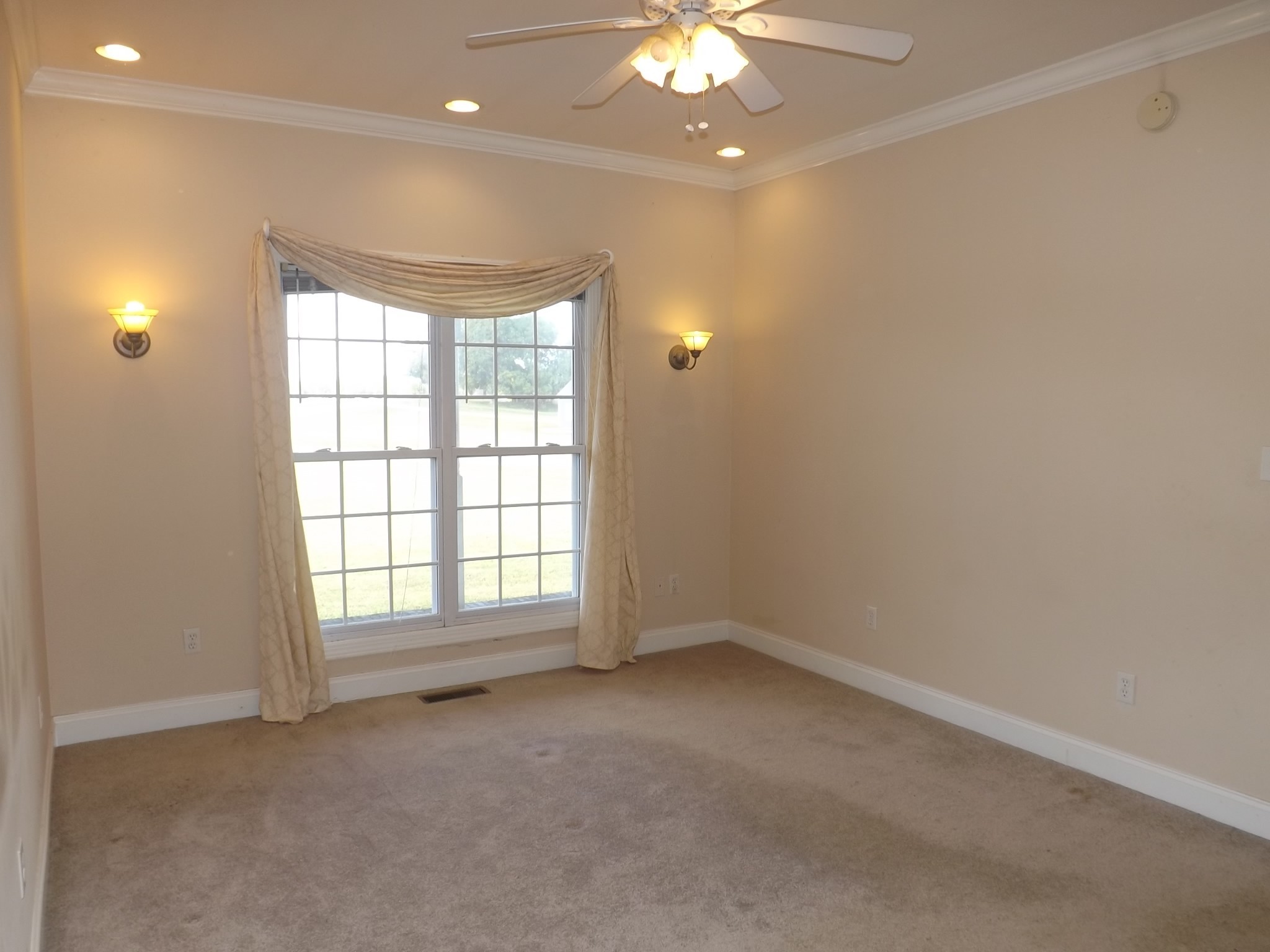 4074 Gum Creek Road Decherd, TN 37324 - Photo 8 of 17 an empty room with a empty space and a ceiling fan