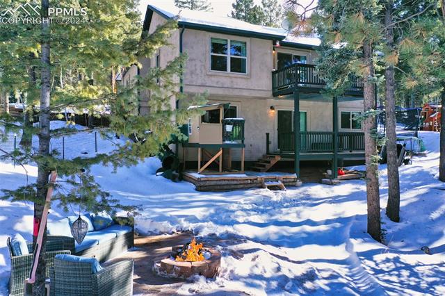 31 Wahsatch Road Florissant, CO 80816 - Photo 39 of 46 Fire pit and patio are a nice addition to this backyard