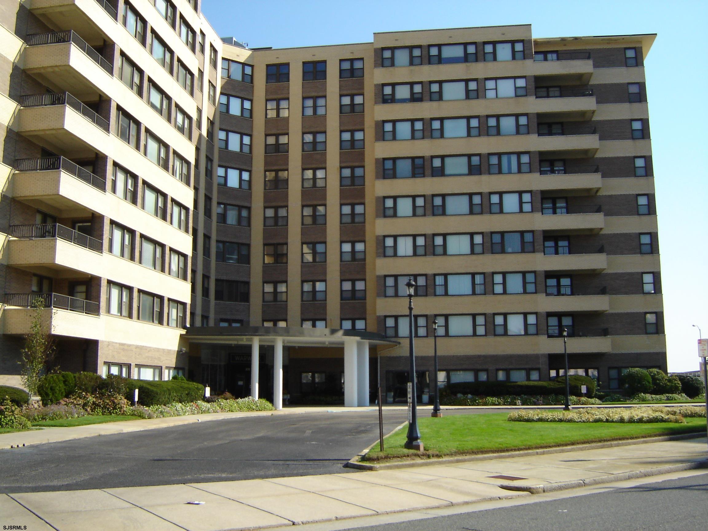 101 South Raleigh Avenue, Unit 213 Atlantic City, NJ 08401 - Photo 1 of 1 a front view of a building with a yard