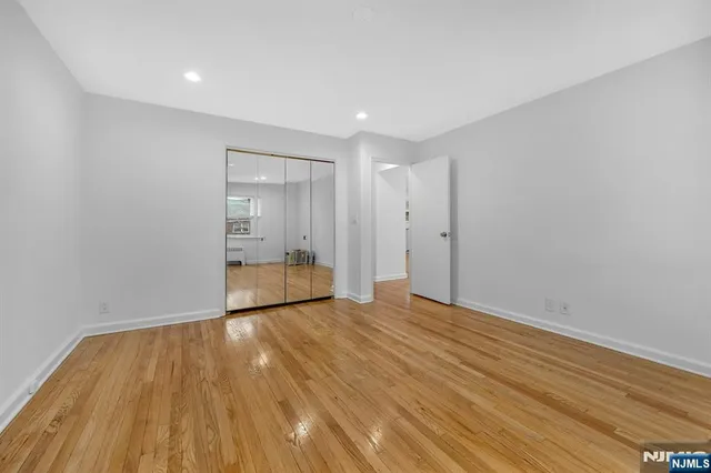 a view of wooden floor in an empty room