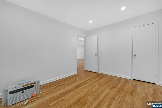 a view of room with wooden floor