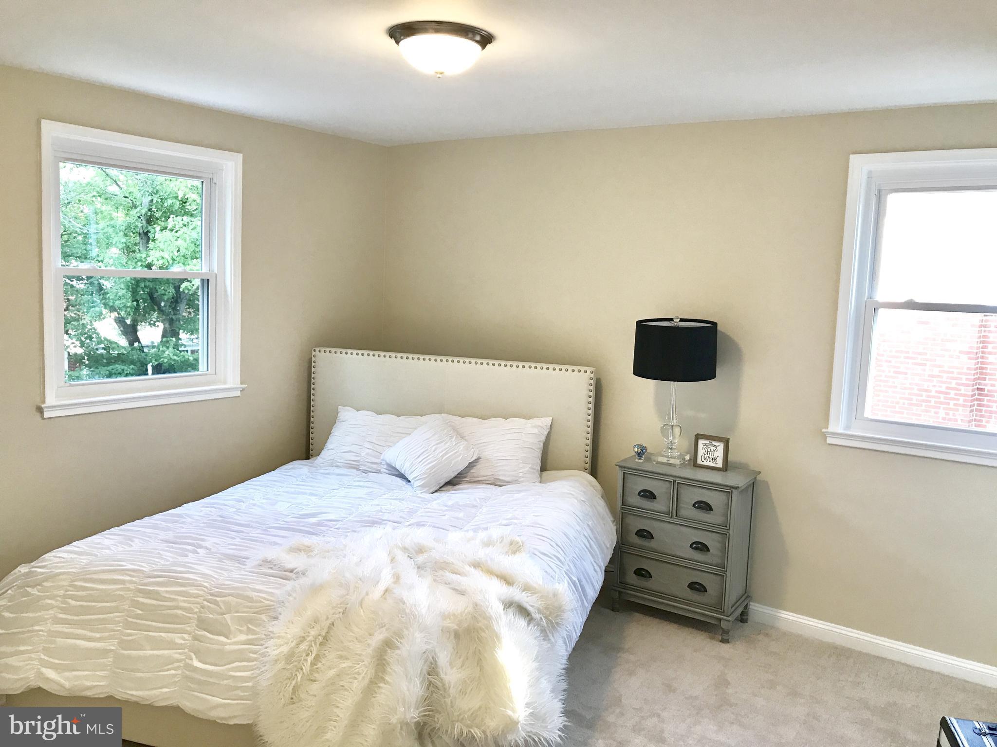 1713 Heathfield Road Baltimore, MD 21239 - Photo 11 of 26 a bedroom with a bed and a window