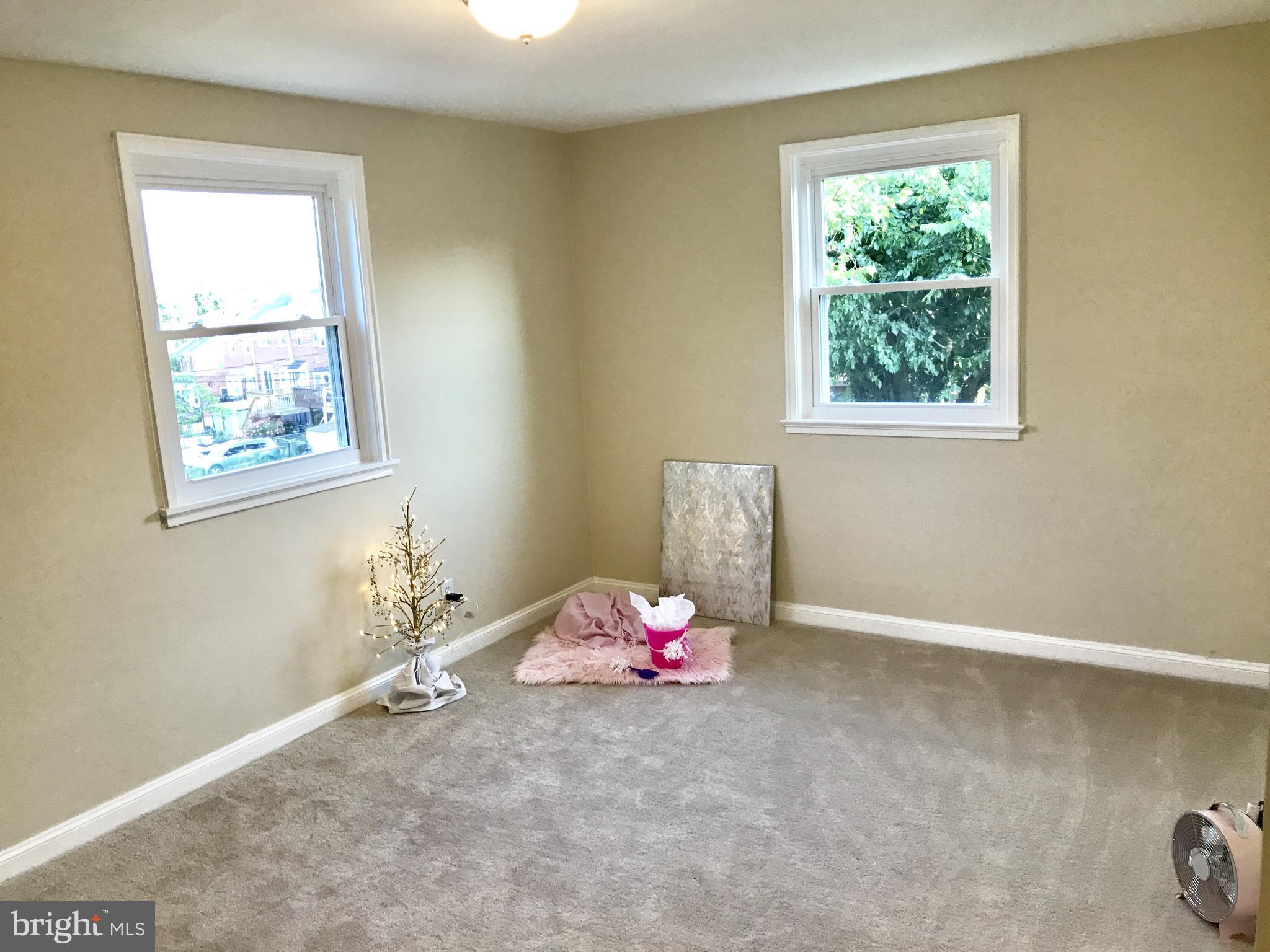 1713 Heathfield Road Baltimore, MD 21239 - Photo 12 of 26 a room with a window