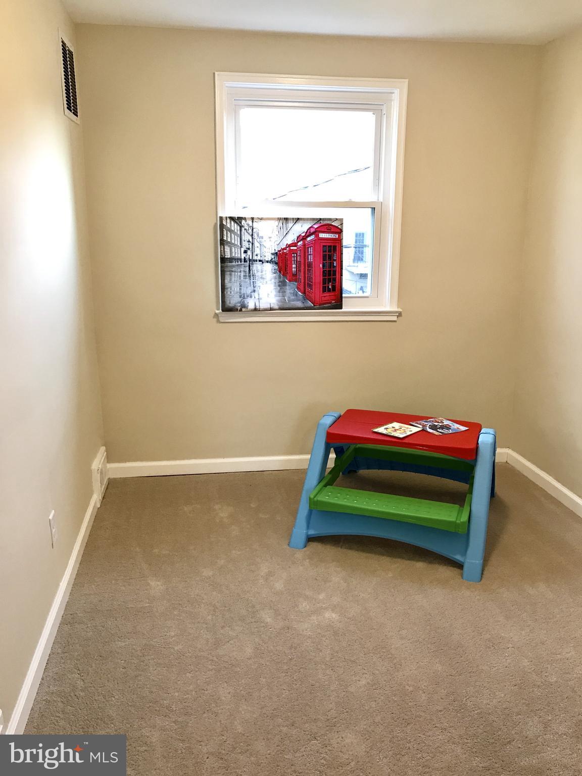 1713 Heathfield Road Baltimore, MD 21239 - Photo 16 of 26 a room with toys and a window