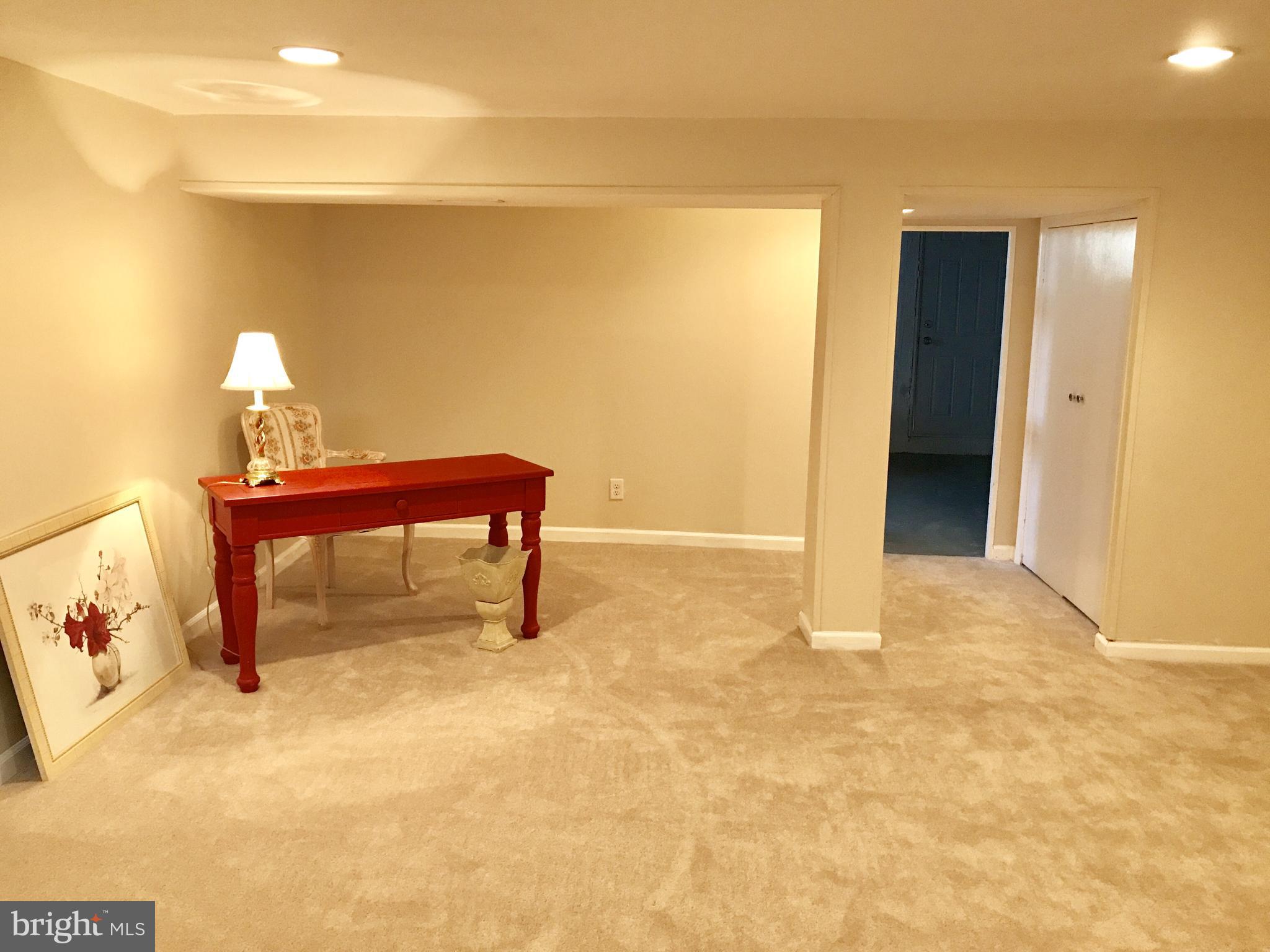 1713 Heathfield Road Baltimore, MD 21239 - Photo 18 of 26 a view of a room with a bench