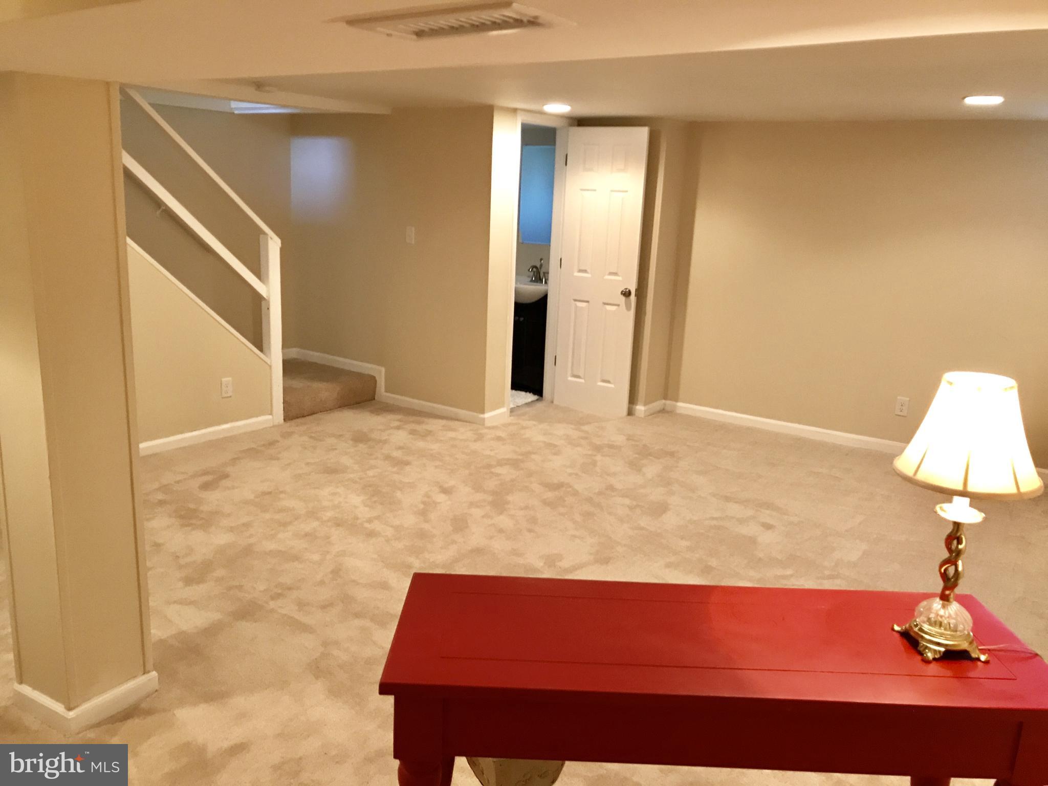 1713 Heathfield Road Baltimore, MD 21239 - Photo 20 of 26 a view of room with a flat screen tv