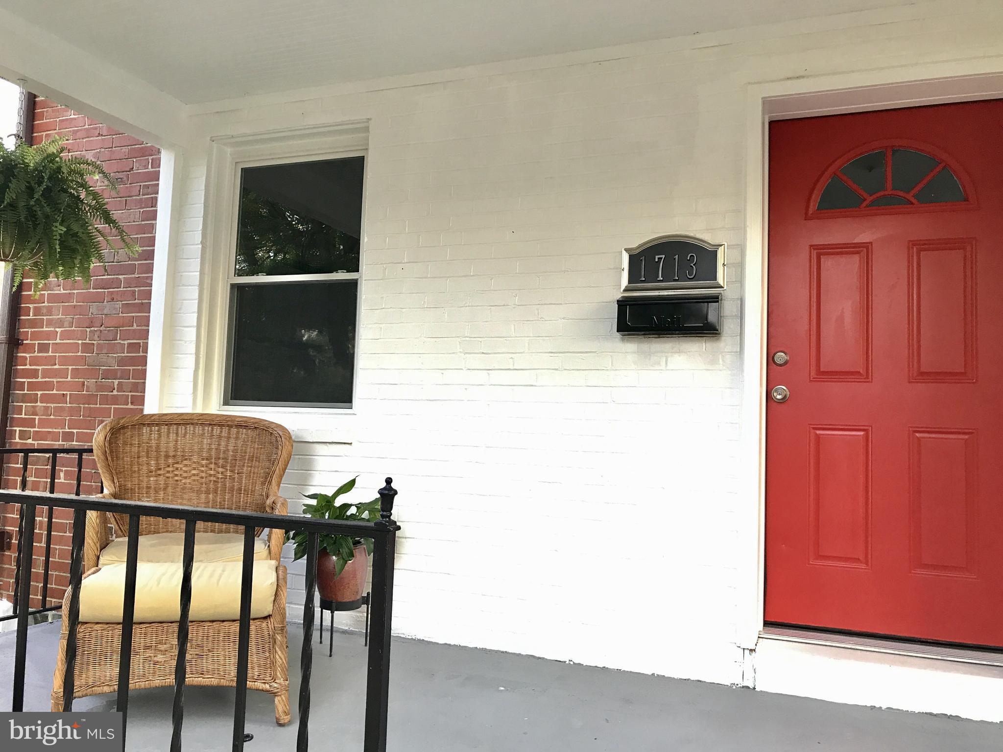1713 Heathfield Road Baltimore, MD 21239 - Photo 23 of 26 a living room with furniture and a window