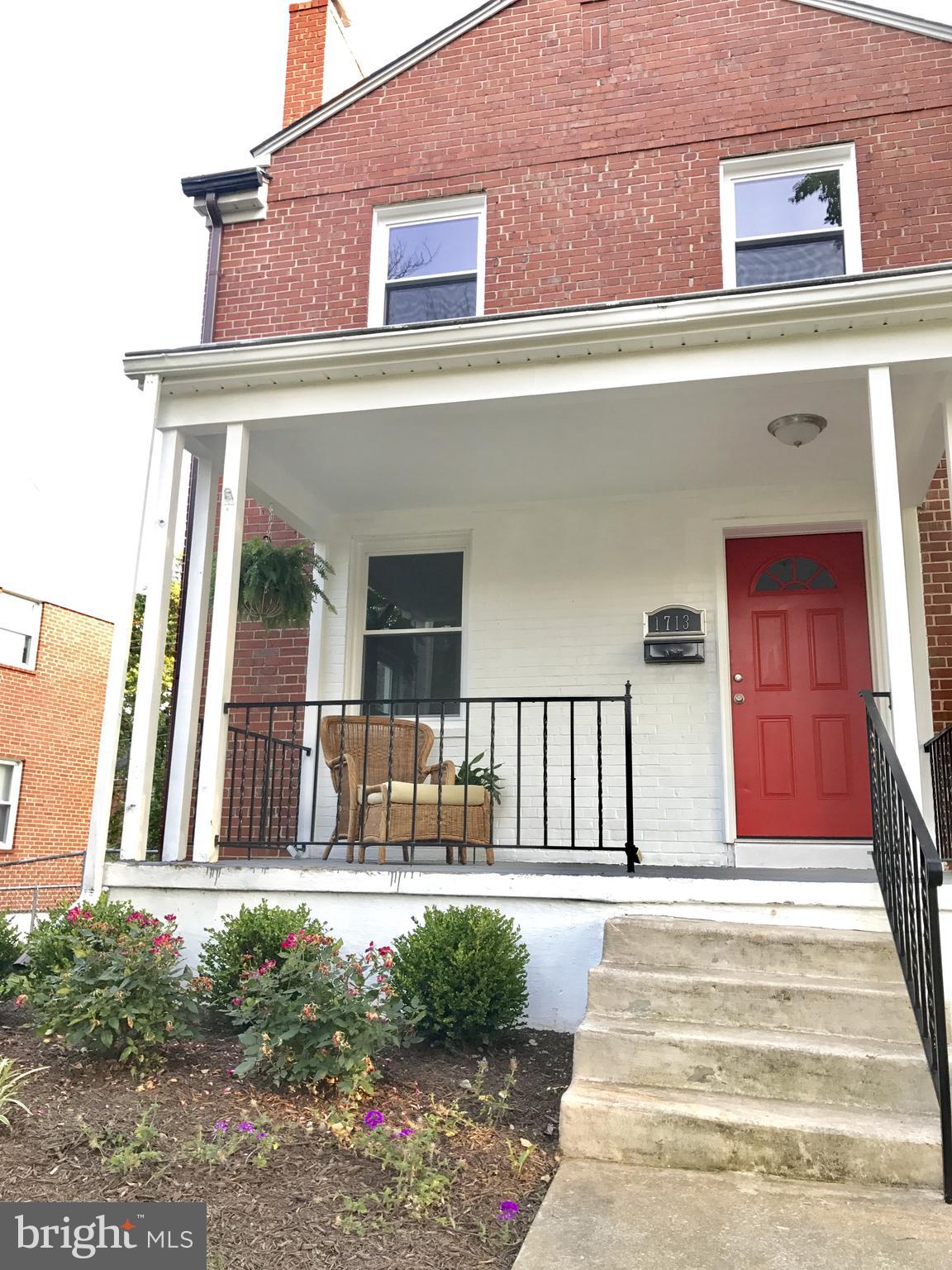1713 Heathfield Road Baltimore, MD 21239 - Photo 25 of 26 a view of a house with a small backyard