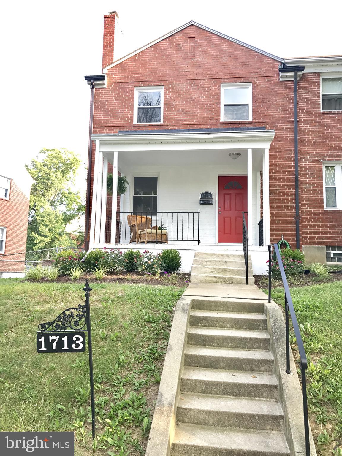 1713 Heathfield Road Baltimore, MD 21239 - Photo 26 of 26 a front view of a house with a yard