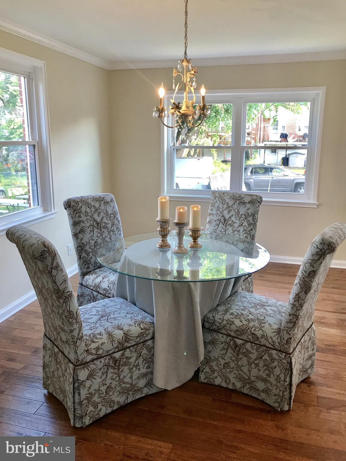1713 Heathfield Road Baltimore, MD 21239 - Photo 4 of 26 a living room with furniture and a chandelier