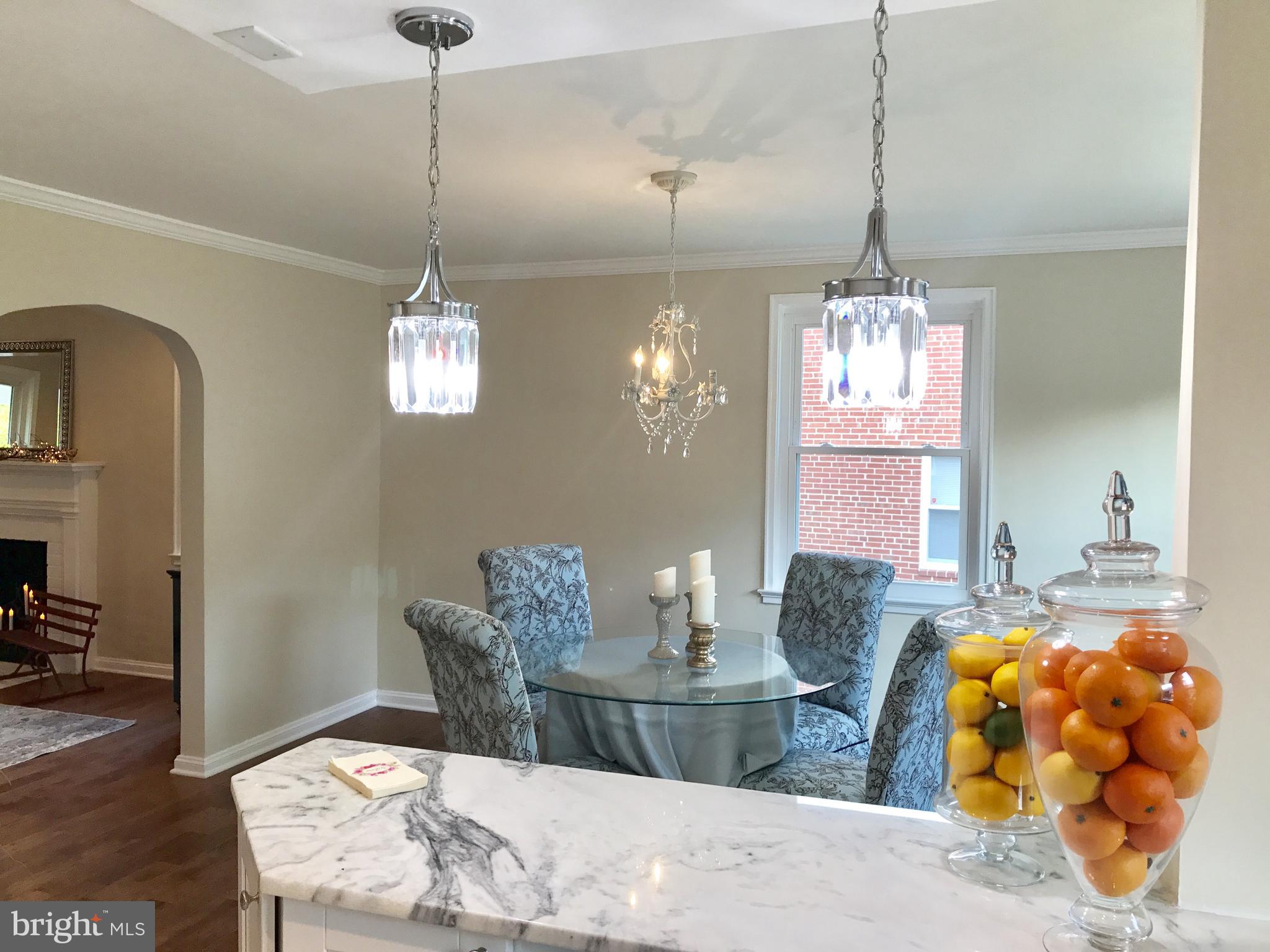 1713 Heathfield Road Baltimore, MD 21239 - Photo 5 of 26 a dining room with a table and chairs