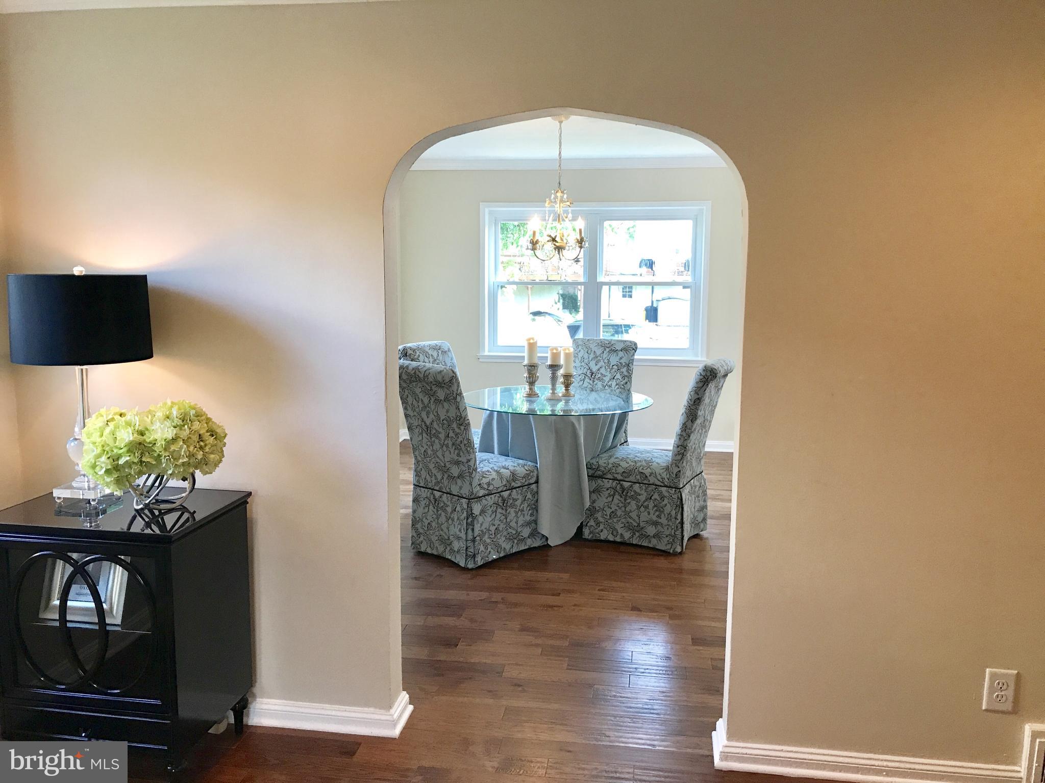 1713 Heathfield Road Baltimore, MD 21239 - Photo 6 of 26 a view of a livingroom with furniture and wooden floor