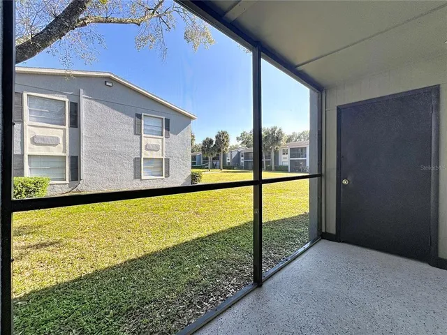 a view of a big room with closet and windows