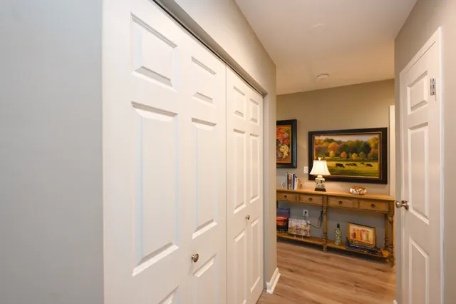 a bedroom with a bed and a dresser in it