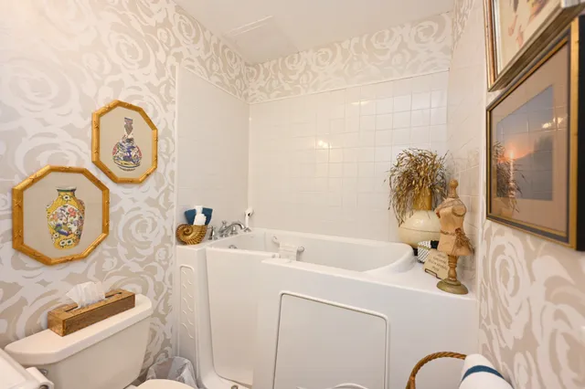 a view of a livingroom with furniture and a work space