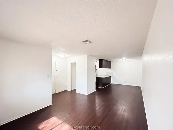 a view of a livingroom with wooden floor