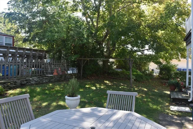 a view of a patio with a yard