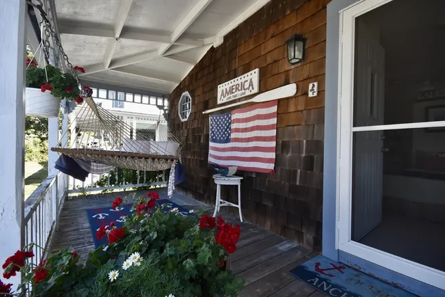 a variety of fruits and vegetables with a building in the background