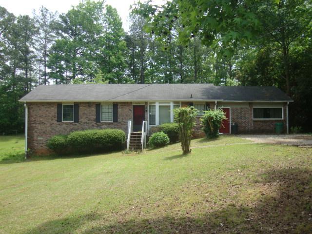 2838 Cocklebur Road Decatur, GA 30034 - Photo 1 of 1 a view of a house with backyard and garden