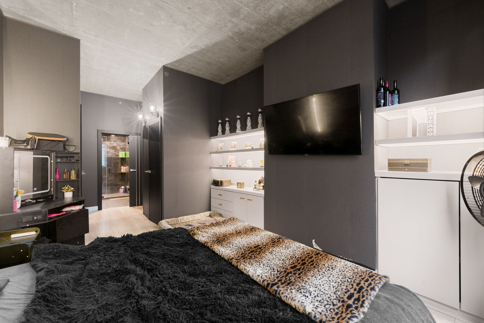 1305 South Michigan Avenue, Unit 907 Chicago, IL 60605 - Photo 12 of 20 a bedroom with a bed and a flat screen tv