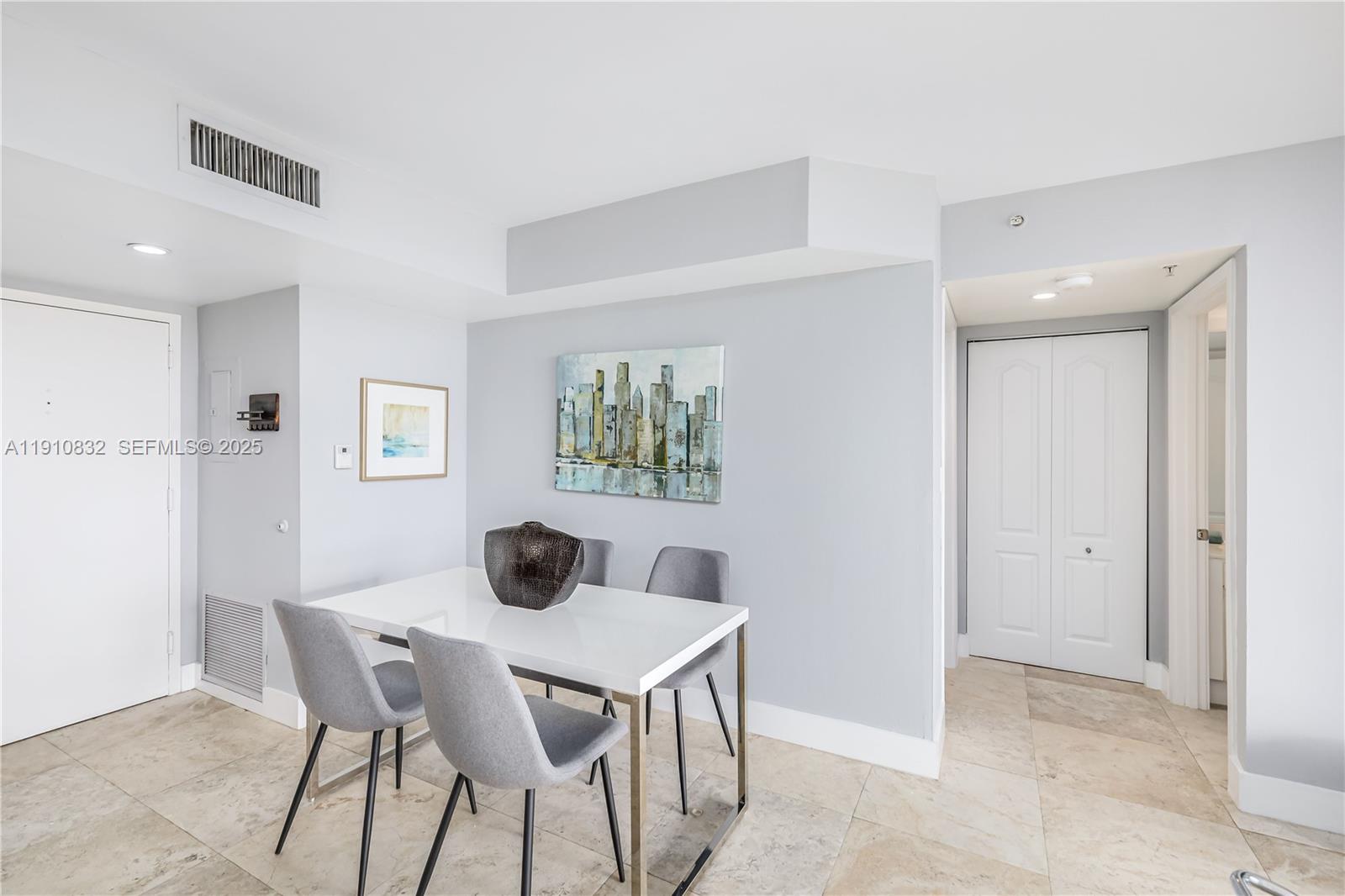 1800 Sunset Harbour Drive, Unit 715 Miami Beach, FL 33139 - Photo 13 of 46 a view of a dining room with furniture and wooden floor