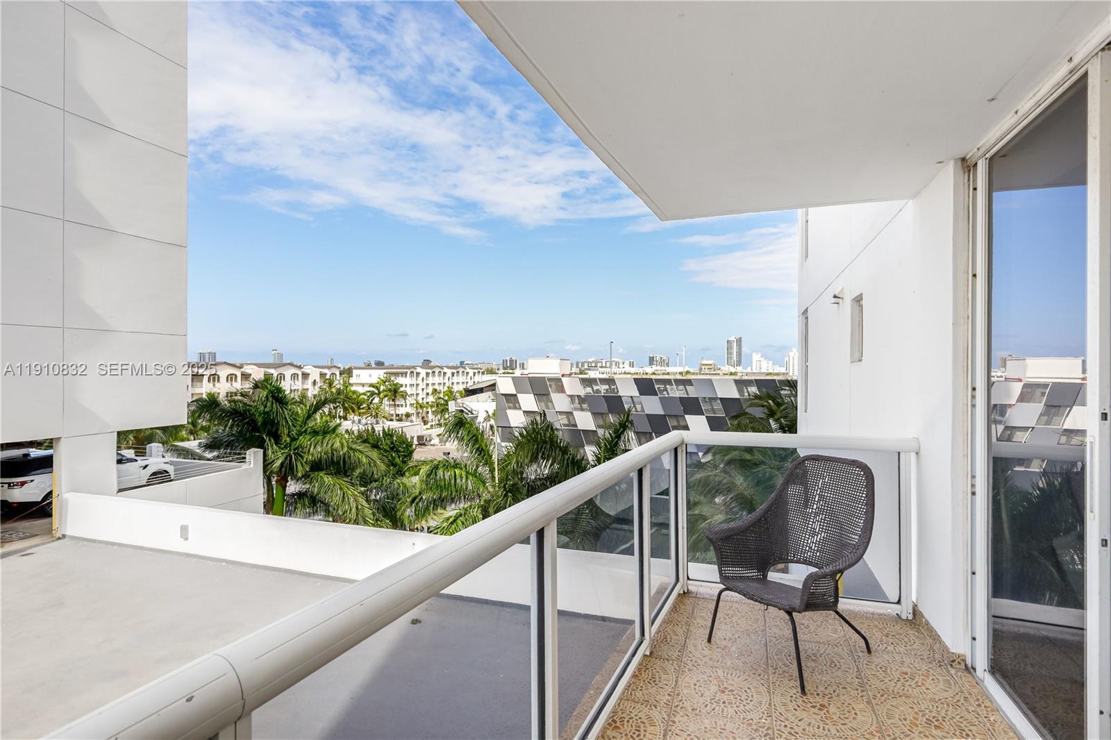 1800 Sunset Harbour Drive, Unit 715 Miami Beach, FL 33139 - Photo 23 of 46 a view of a balcony with chair and table