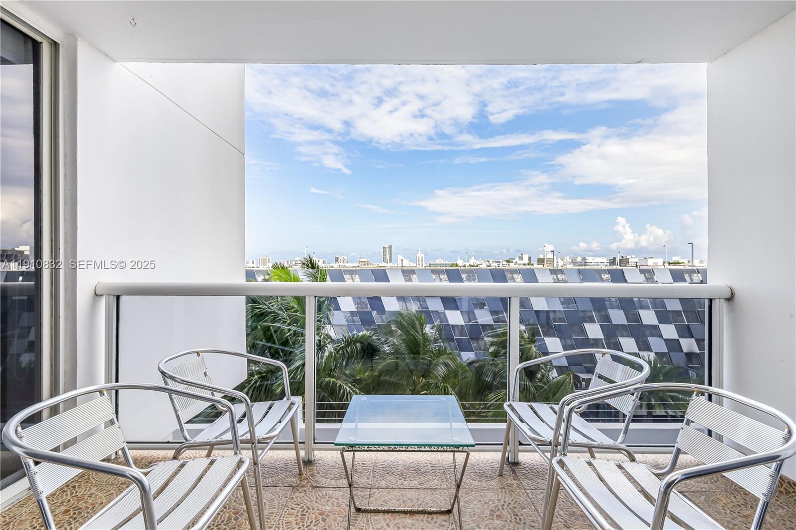 1800 Sunset Harbour Drive, Unit 715 Miami Beach, FL 33139 - Photo 5 of 46 a picture of a table and chairs in the terrace