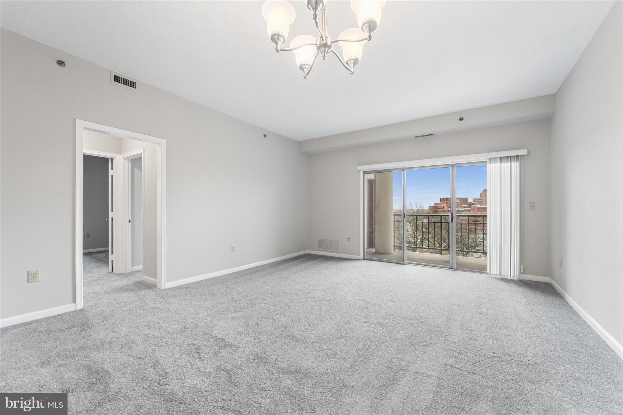 545 East Braddock Road, Unit 602 Alexandria, VA 22314 - Photo 15 of 41 LIVING AREA LOOKS OUT TO BALCONY