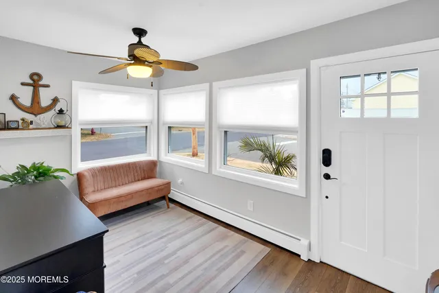 a bedroom with furniture and a window