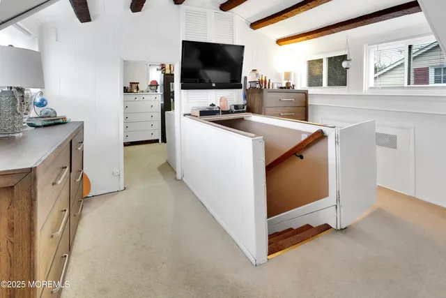 a kitchen with stainless steel appliances a stove microwave and refrigerator