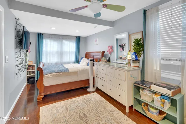 a bedroom with furniture and a window