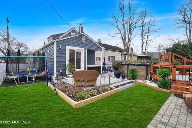 a view of a house with a yard porch and sitting area