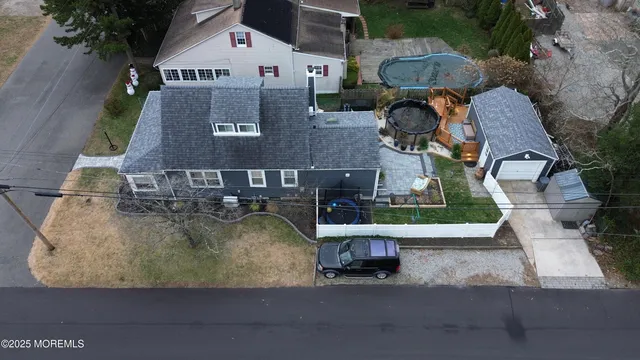 an aerial view of a house with swimming pool