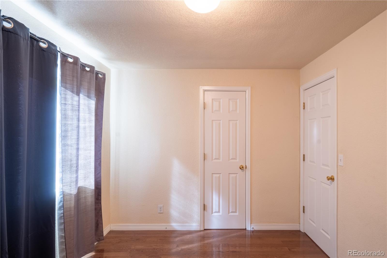 1124 Newark Street Aurora, CO 80010 - Photo 11 of 32 a view of an empty room