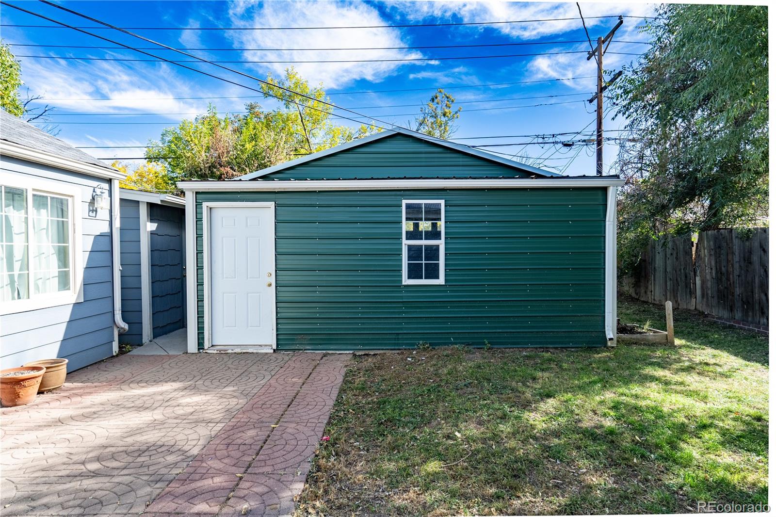 1124 Newark Street Aurora, CO 80010 - Photo 20 of 32 a view of a small house