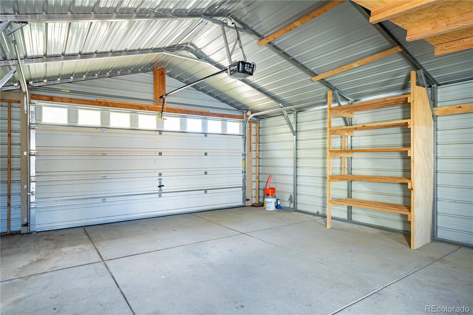 1124 Newark Street Aurora, CO 80010 - Photo 21 of 32 a view of a room with storage and utility