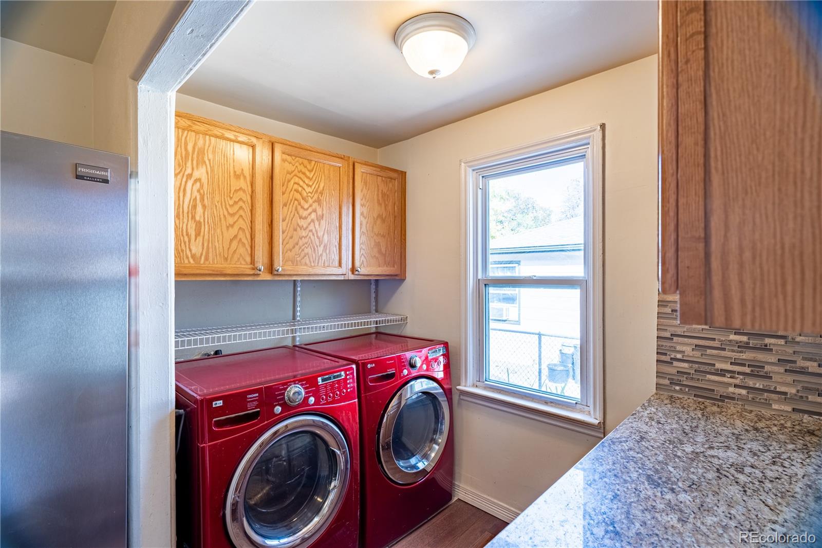 1124 Newark Street Aurora, CO 80010 - Photo 8 of 32 a utility room with dryer and washer